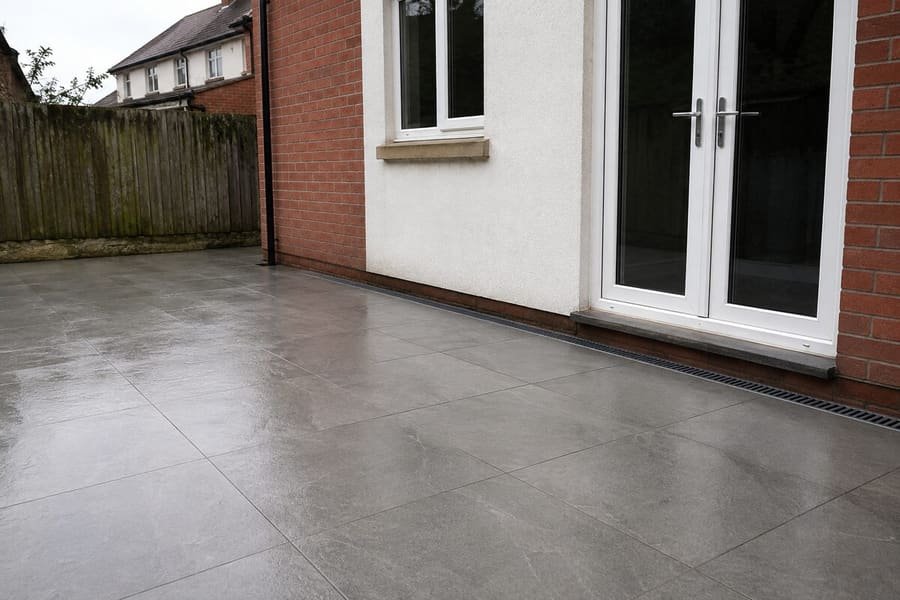 Porcelain patio laid to falls