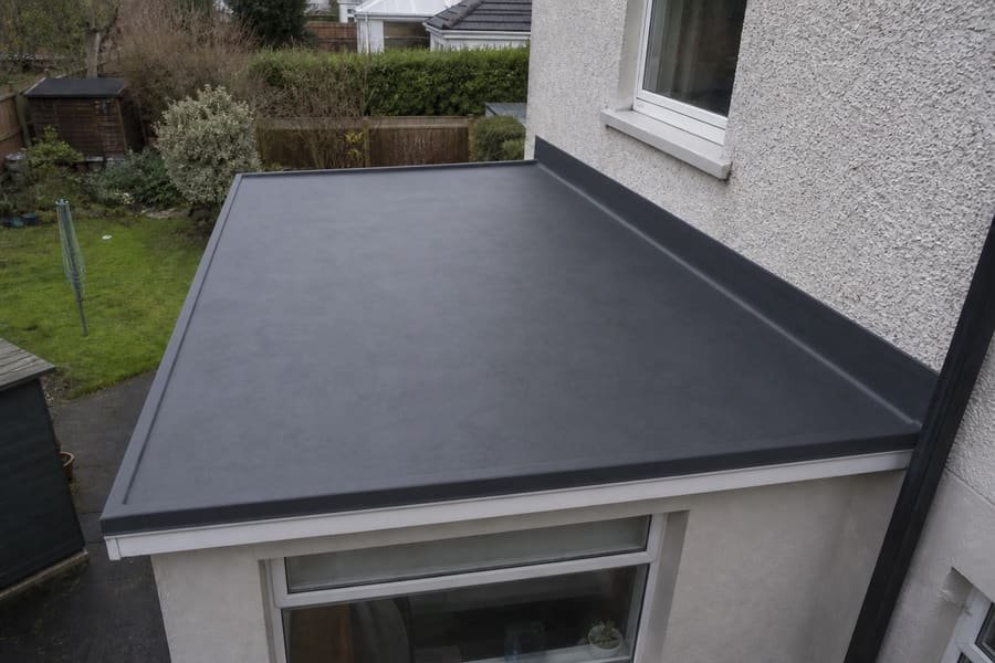 The same flat roof finished in a single-piece EPDM membrane laid to a fall.